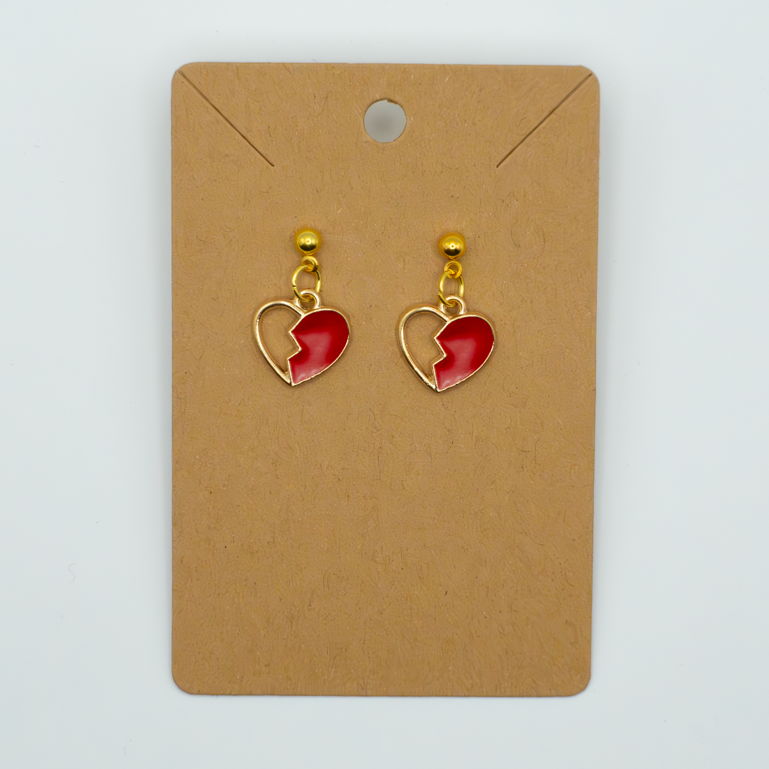 Express your unique style with this edgy earring featuring a striking enamel broken heart charm. Perfect for adding a touch of rebellion and romance to any outfit. 