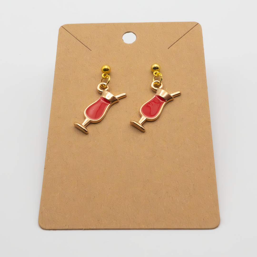 Spice up your style with these playful earrings featuring a cluster of enamel red drink charms. Perfect for adding a touch of fun and personality to any outfit.