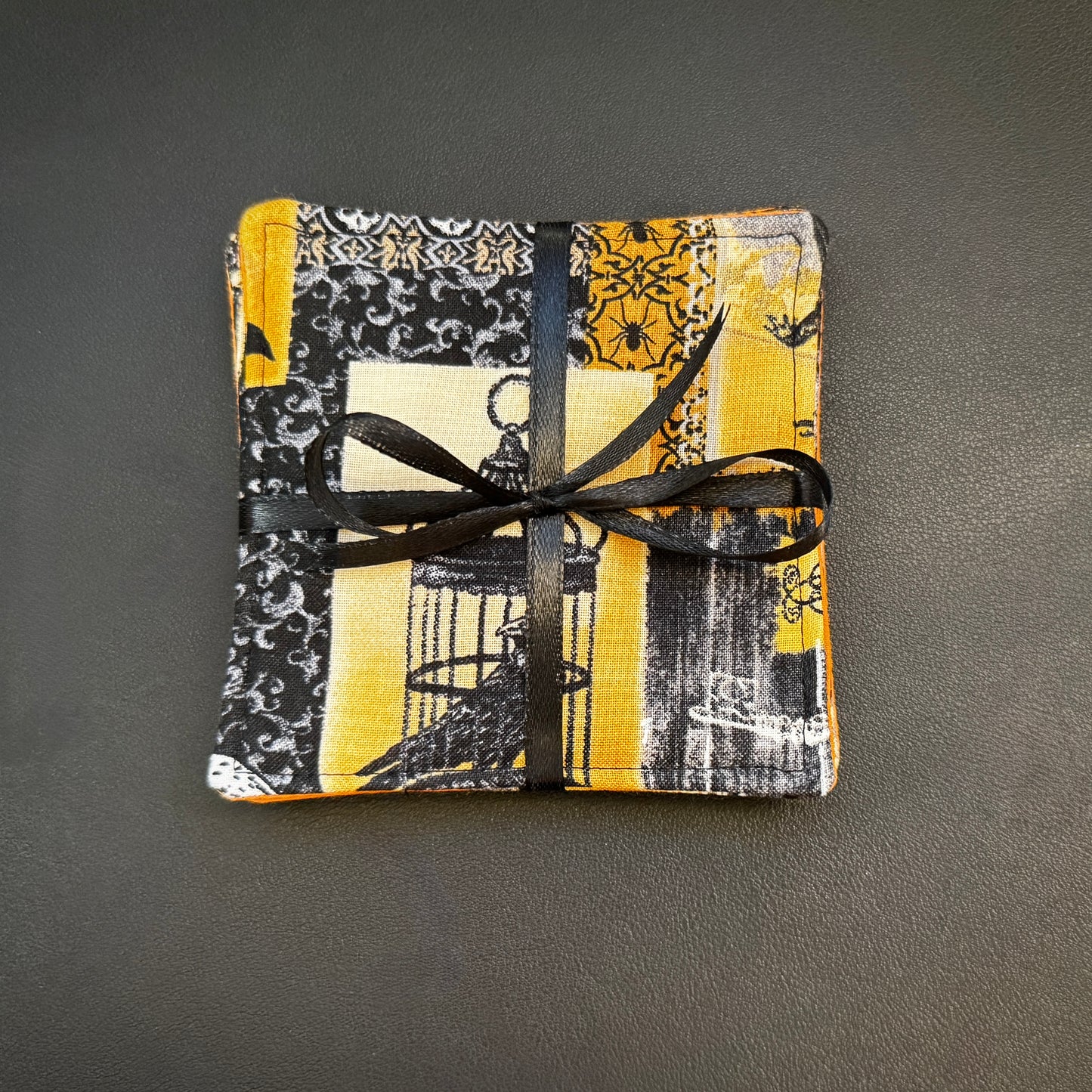 Step into a world of dark elegance and antiquarian intrigue with this stunning set of 4 handmade cotton coasters. Seamlessly blending a Victorian gothic aesthetic with classic macabre elements, these unique drink mats bring an air of sophisticated, dark fantasy storytelling to your home decor.