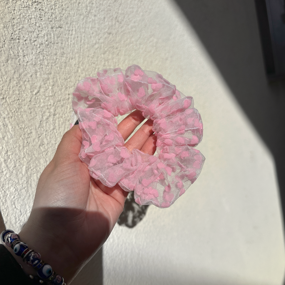 Effortlessly chic! This dreamy scrunchie is crafted from soft tulle with delicate velvet hearts. Adds a touch of romance and elegance to any hairstyle. Perfect for everyday wear or special occasions.