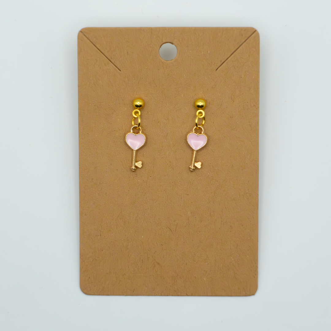 Fall in love with these adorable earrings featuring mini red hearts. Perfect for adding a touch of playful romance to any outfit.