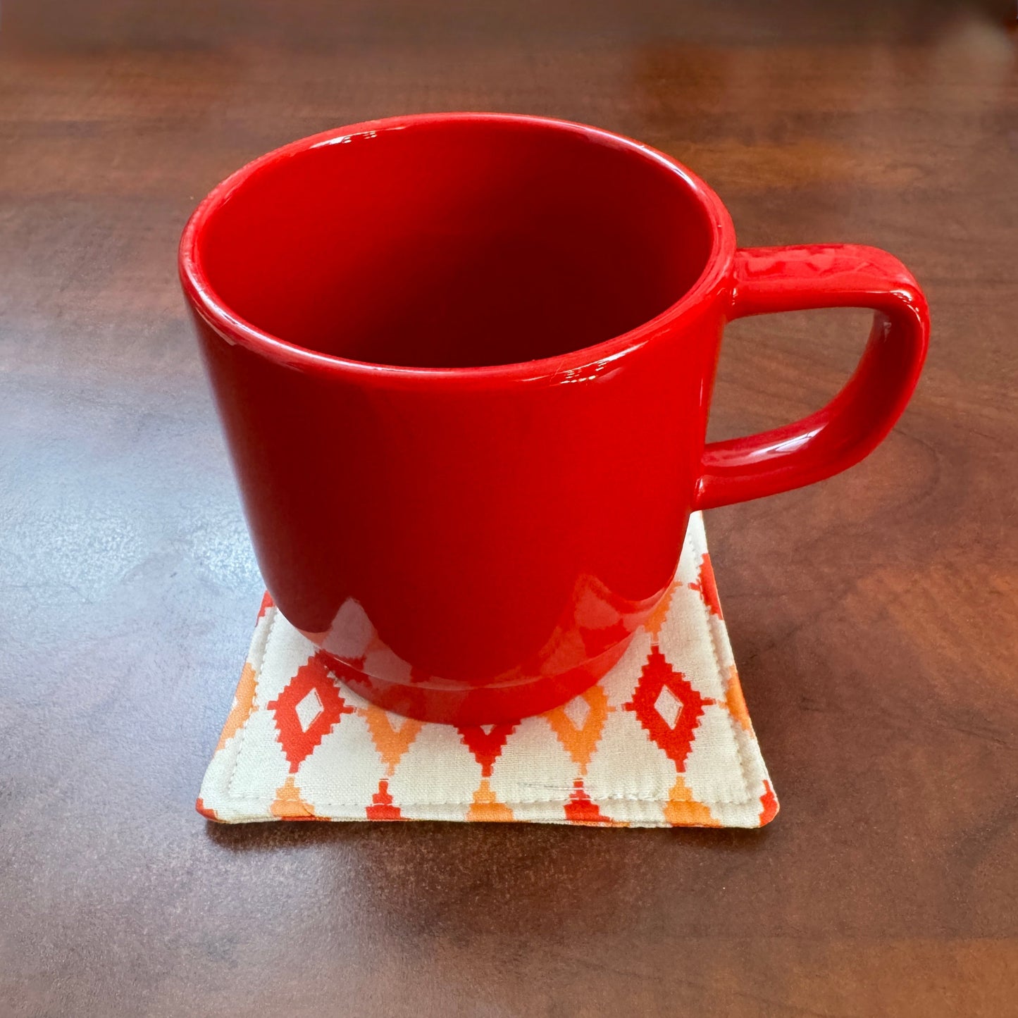 Elevate your space with this playful 100% cotton retro diamond coaster. Featuring a vibrant and stylish retro diamond print, this coaster brings a touch of retro flair and fun to your home. Crafted with an absorbent cotton batting layer inside, it's designed to soak up condensation and protect your furniture from unsightly water rings and spills. Perfect for coffee mugs, glasses, or teacups, this durable and machine-washable coaster is a delightful addition to your kitchen or living room. Elevate your home