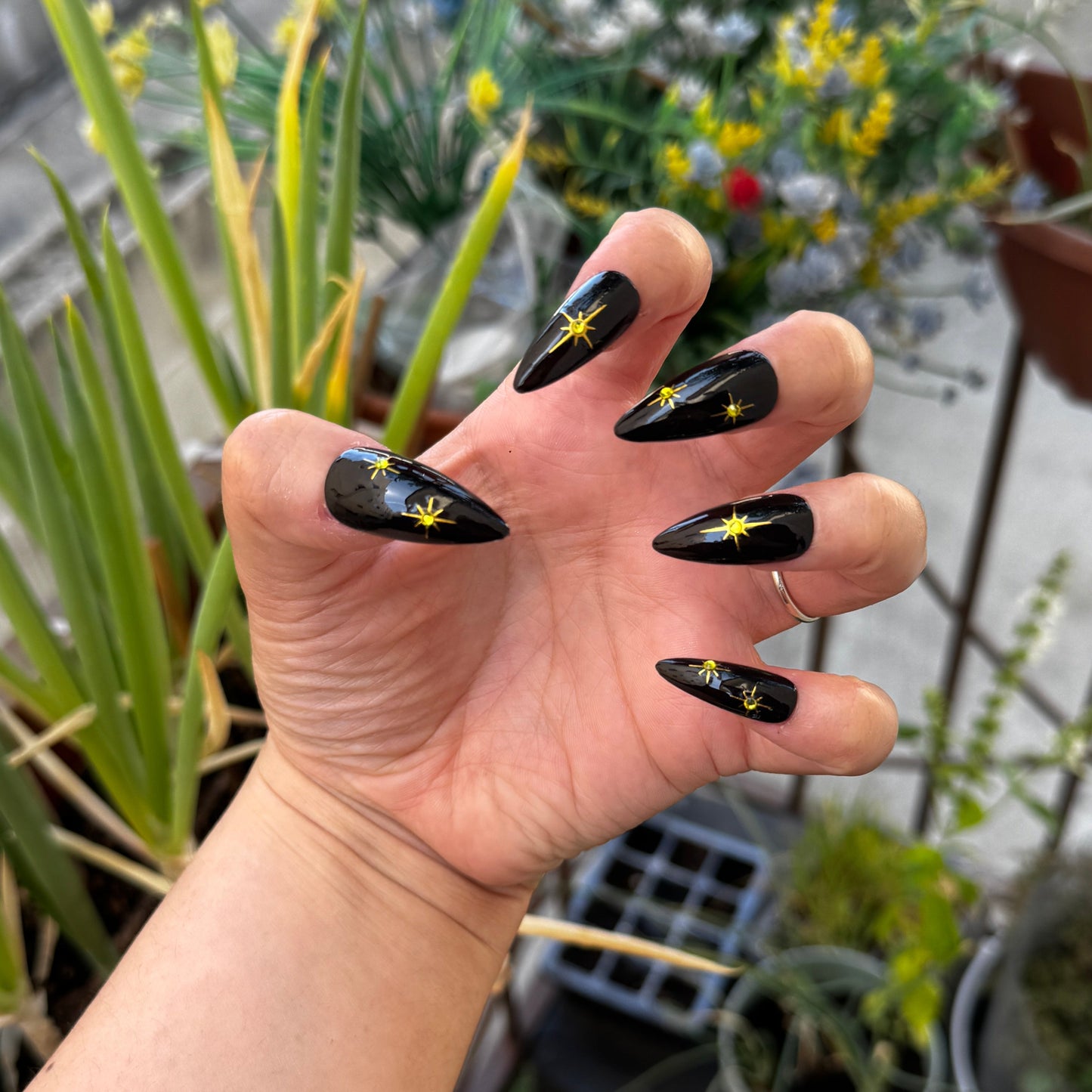 Get ready for "The Witching Hour" with these stunning, celestial press-on nails. Featuring a mysterious, deep black base and shimmering gold stars, this set captures the magic of a midnight sky. Each set is a miniature work of art, meticulously designed and hand-painted, adding a unique flair to any occasion. No time for salon appointments? Say hello to instant glamour that’s ready whenever you are. Our durable, high-quality press-ons offer a flawless, comfortable fit and are designed to last.