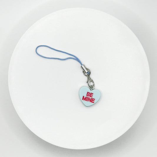 Add a touch of sweetness to your everyday! Our blue candy heart phone charm and keychain is the perfect accessory for Valentine’s Day and beyond. Cute, durable, and versatile, it’s the perfect gift for yourself or a loved one.