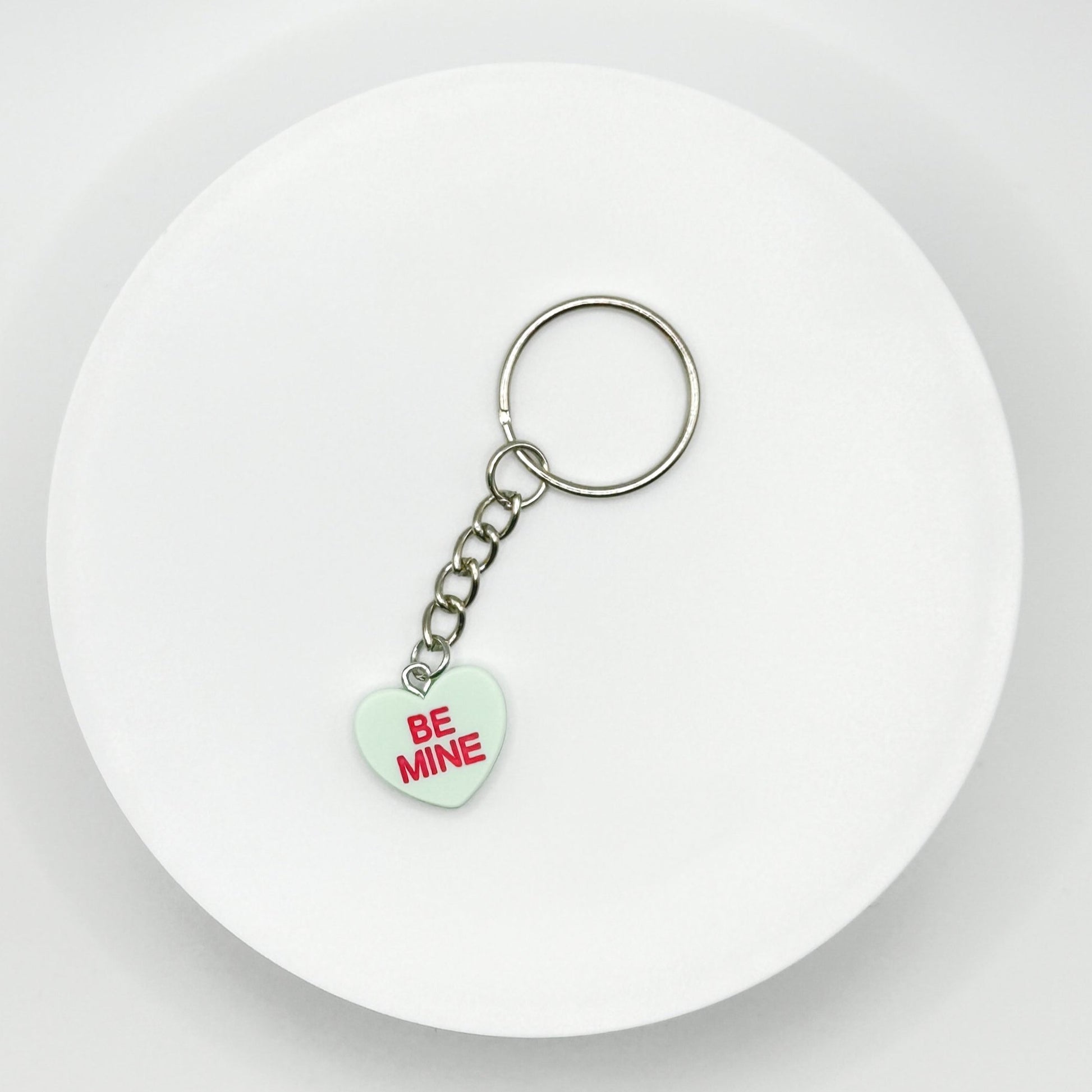 Add a touch of sweetness to your everyday! Our green candy heart phone charm and keychain is the perfect accessory for Valentine’s Day and beyond. Cute, durable, and versatile, it’s the perfect gift for yourself or a loved one.