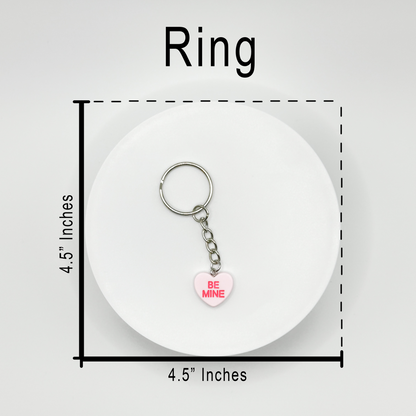 Add a touch of sweetness to your everyday! Our pink candy heart phone charm and keychain is the perfect accessory for Valentine’s Day and beyond. Cute, durable, and versatile, it’s the perfect gift for yourself or a loved one.