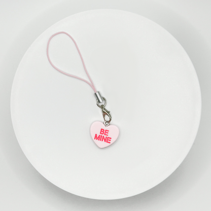 Add a touch of sweetness to your everyday! Our pink candy heart phone charm and keychain is the perfect accessory for Valentine’s Day and beyond. Cute, durable, and versatile, it’s the perfect gift for yourself or a loved one.