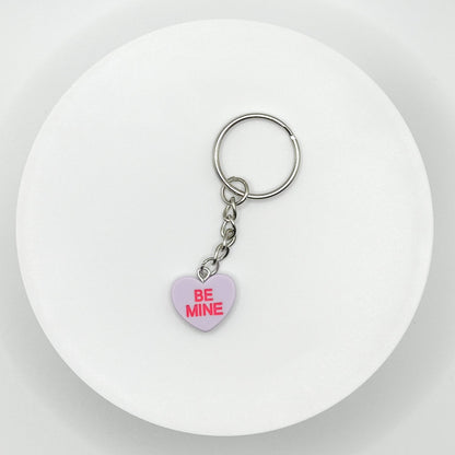 Add a touch of sweetness to your everyday! Our purple candy heart phone charm and keychain is the perfect accessory for Valentine’s Day and beyond. Cute, durable, and versatile, it’s the perfect gift for yourself or a loved one.