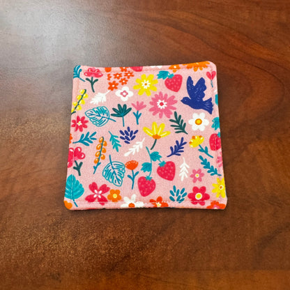 Elevate your space with this playful 100% cotton bird and bloom coaster. Featuring a vibrant and stylish floral and bird print, this coaster brings a touch of whimsical fun to your home. Crafted with an absorbent cotton batting layer inside, it's designed to soak up condensation and protect your furniture from unsightly water rings and spills. Perfect for coffee mugs, glasses, or teacups, this durable and machine-washable coaster is a delightful addition to your kitchen or living room. Elevate your home dec