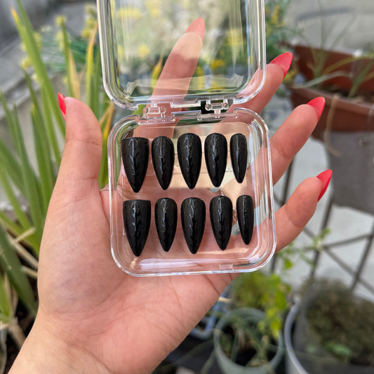 Get ready for "Black Web" with these stunning, spiderweb design press-on nails. Featuring a matte black base and a glossy black web. Each set is a miniature work of art, meticulously designed and hand-painted, adding a unique flair to any occasion. No time for salon appointments? Say hello to instant glamour that’s ready whenever you are. Our durable, high-quality press-ons offer a flawless, comfortable fit and are designed to last.