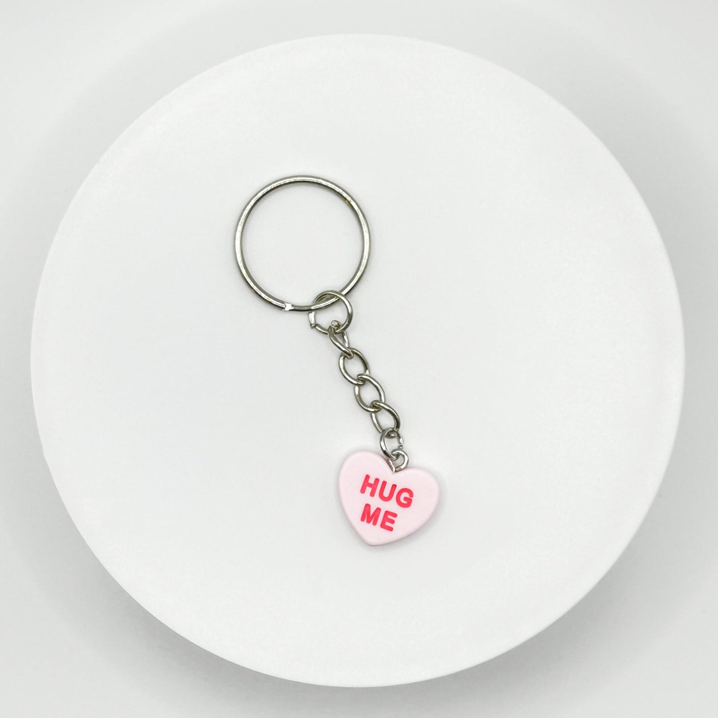 Add a touch of sweetness to your everyday! Our pink candy heart phone charm and keychain is the perfect accessory for Valentine’s Day and beyond. Cute, durable, and versatile, it’s the perfect gift for yourself or a loved one.