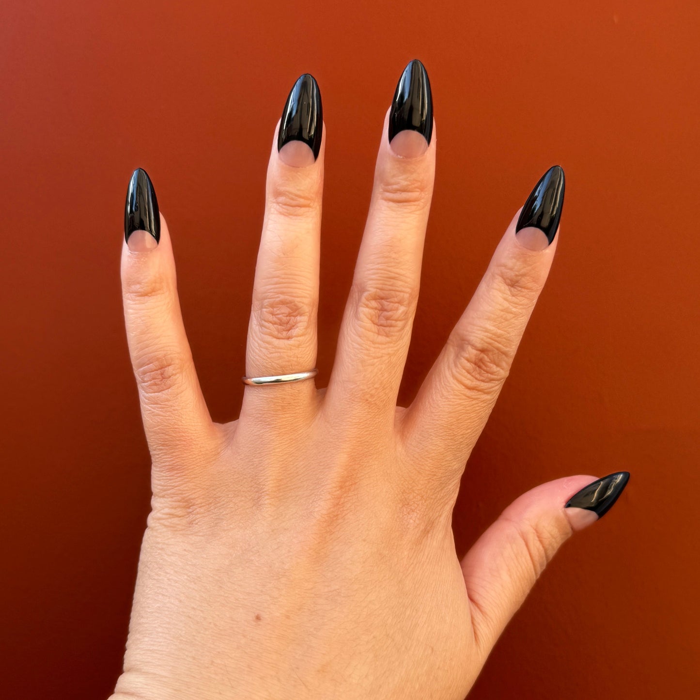 Get ready for "The Black Half Moon" and embrace dark glamour with these stunning handmade press-on nails, featuring a nude base and delicate, black half moon design
