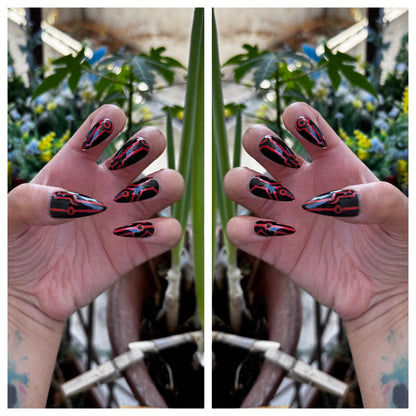 Get ready for "The Grid" with these stunning, glow in the dark press-on nails. Featuring a black base and red grid design with a glossy finish. Each set is a miniature work of art, meticulously designed and hand-painted, adding a unique flair to any occasion. No time for salon appointments? Say hello to instant glamour that’s ready whenever you are. Our durable, high-quality press-ons offer a flawless, comfortable fit and are designed to last.&nbsp;