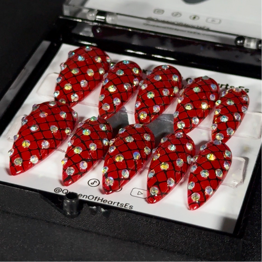 Get ready for "The Net of Desires" and embrace vintage glamour with these stunning press-on nails, featuring a rich red base and a delicate, sparkling hairnet pattern. Adorned with brilliant rhinestones, this set pays homage to the iconic, original sparkly hairnets from Wearable Art by Jenny Dame. Each set is a miniature work of art—meticulously hand-painted and designed to bring a unique, dramatic flair to any occasion. No time for salon appointments? Say hello to instant glamour that’s ready whenever.
