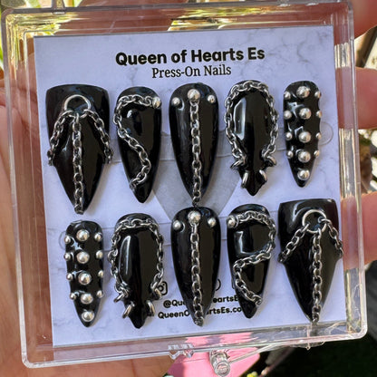 Get ready for "The Alt Baddie" and embrace dark glamour with these stunning handmade press-on nails, featuring a black base and delicate, chain and chrome design.