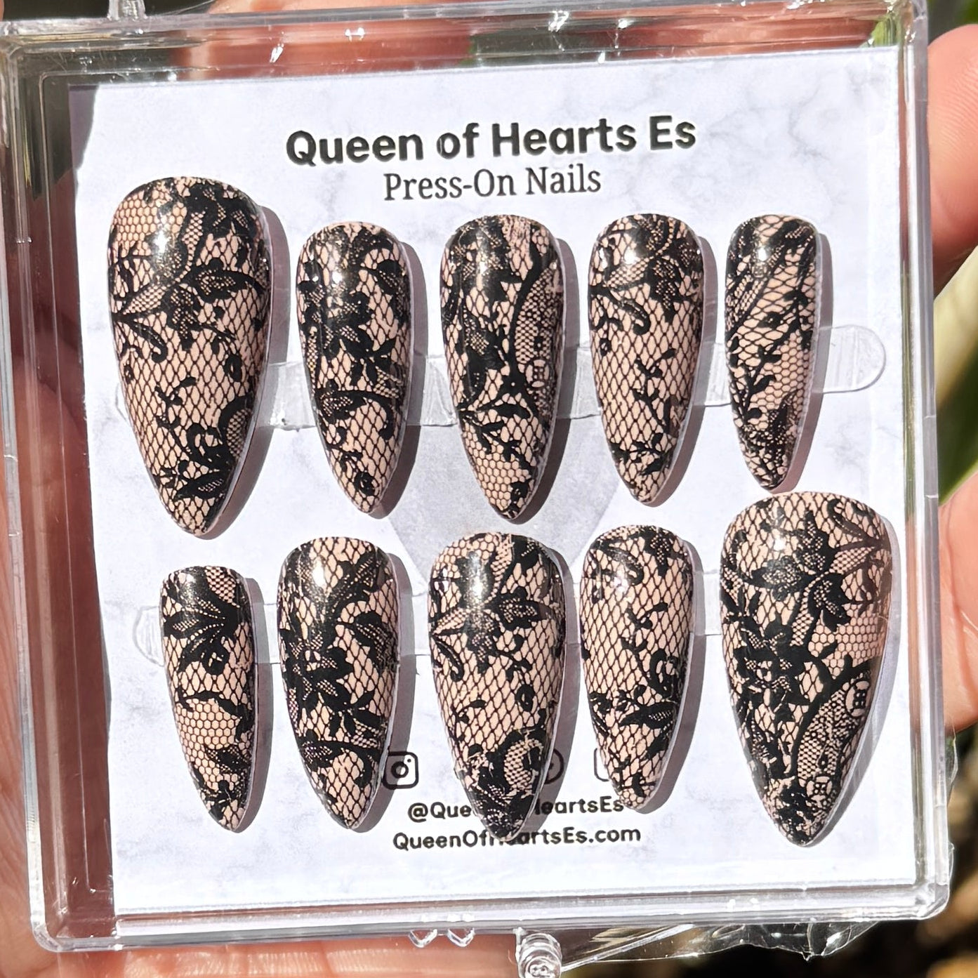 Get ready for "The Seductress" and embrace dark glamour with these stunning handmade press-on nails, featuring a rich nude base and delicate, black lace design.&nbsp;