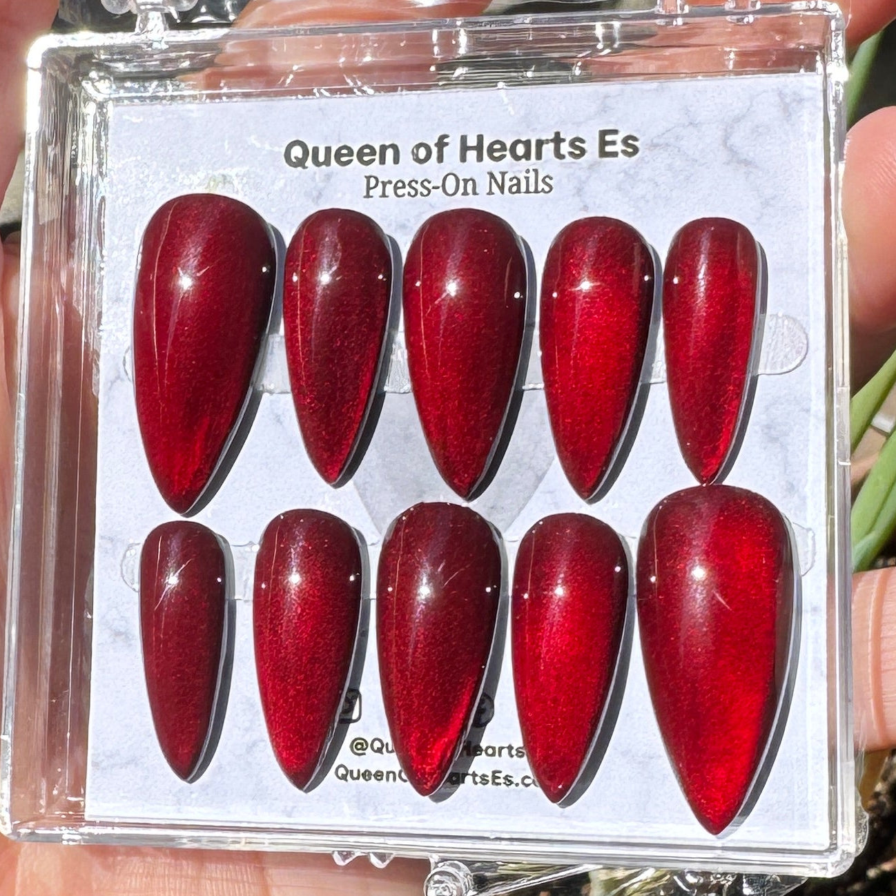 Get ready for "The Romantic" and embrace dark glamour with these stunning handmade press-on nails, featuring a red cat eye base and delicate, reflective design.