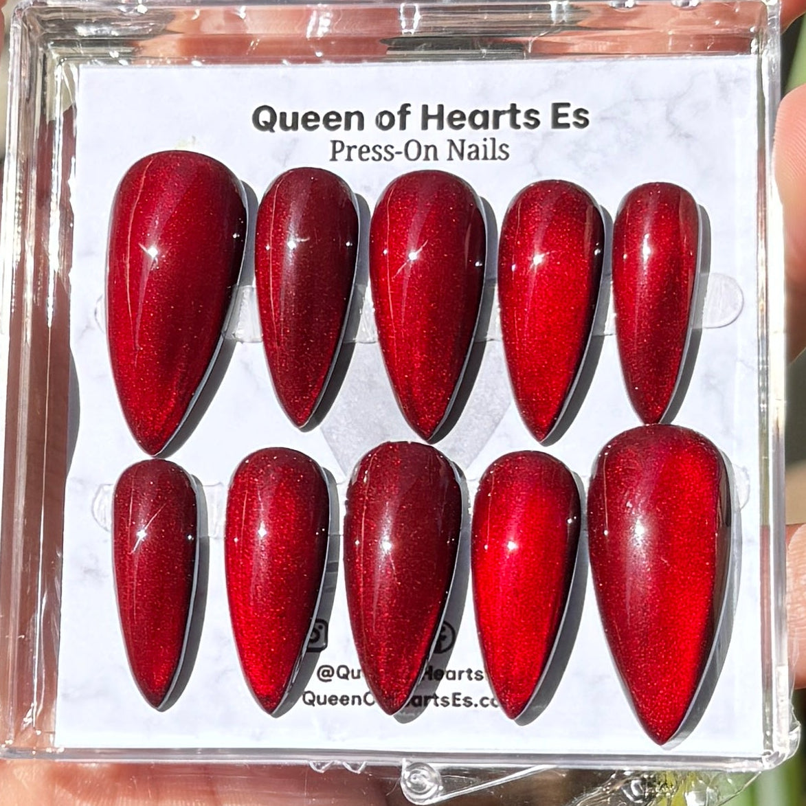 Get ready for "The Romantic" and embrace dark glamour with these stunning handmade press-on nails, featuring a red cat eye base and delicate, reflective design.
