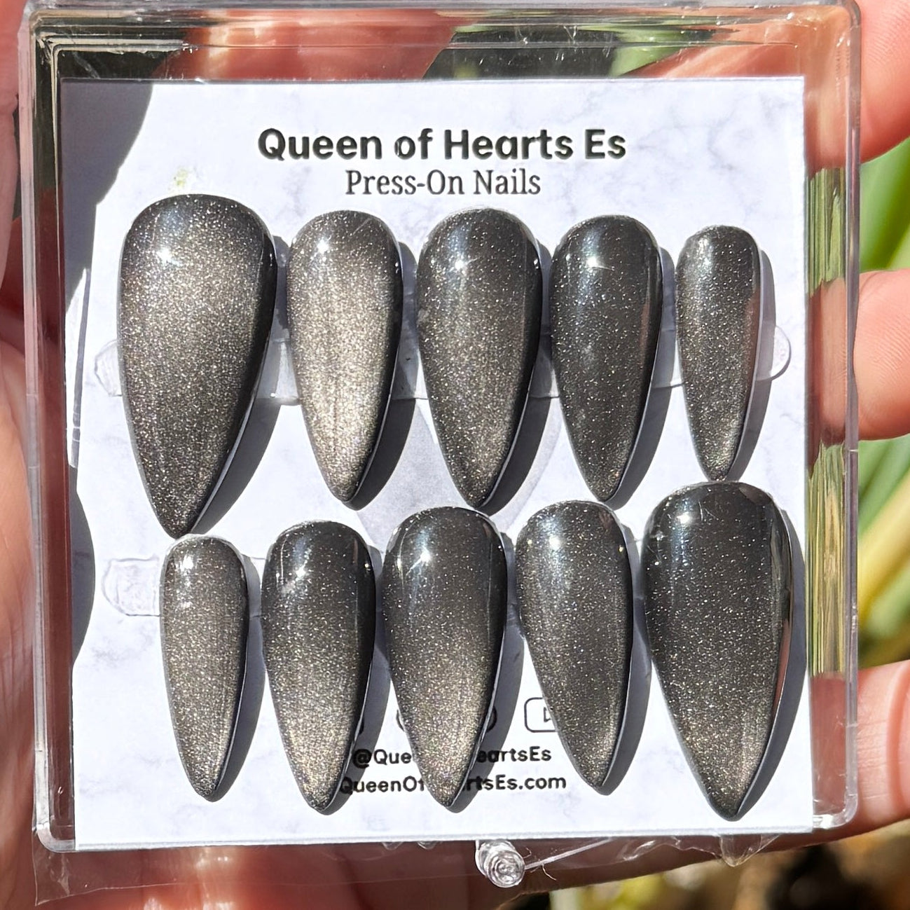 Get ready for "The Apparition" and embrace dark glamour with these stunning handmade press-on nails, featuring a silver cat eye base and delicate, reflective design.