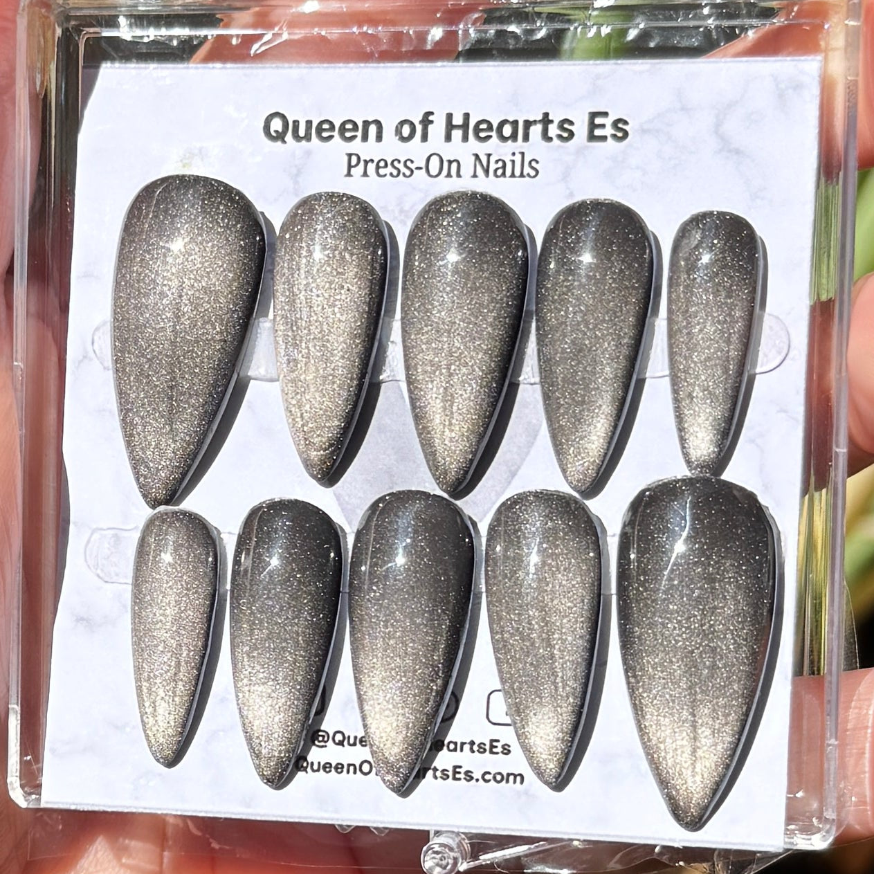Get ready for "The Apparition" and embrace dark glamour with these stunning handmade press-on nails, featuring a silver cat eye base and delicate, reflective design.