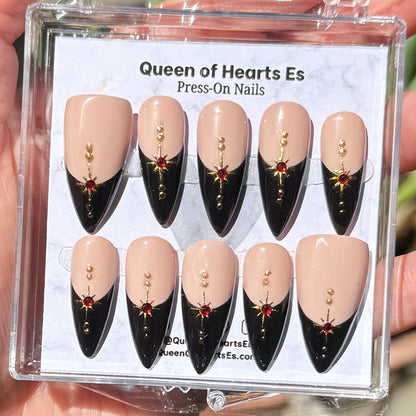 Get ready for "The Witching Hour 2.0" and embrace dark glamour with these stunning handmade press-on nails, featuring a rich nude base and delicate, black french tip and star design.&nbsp;