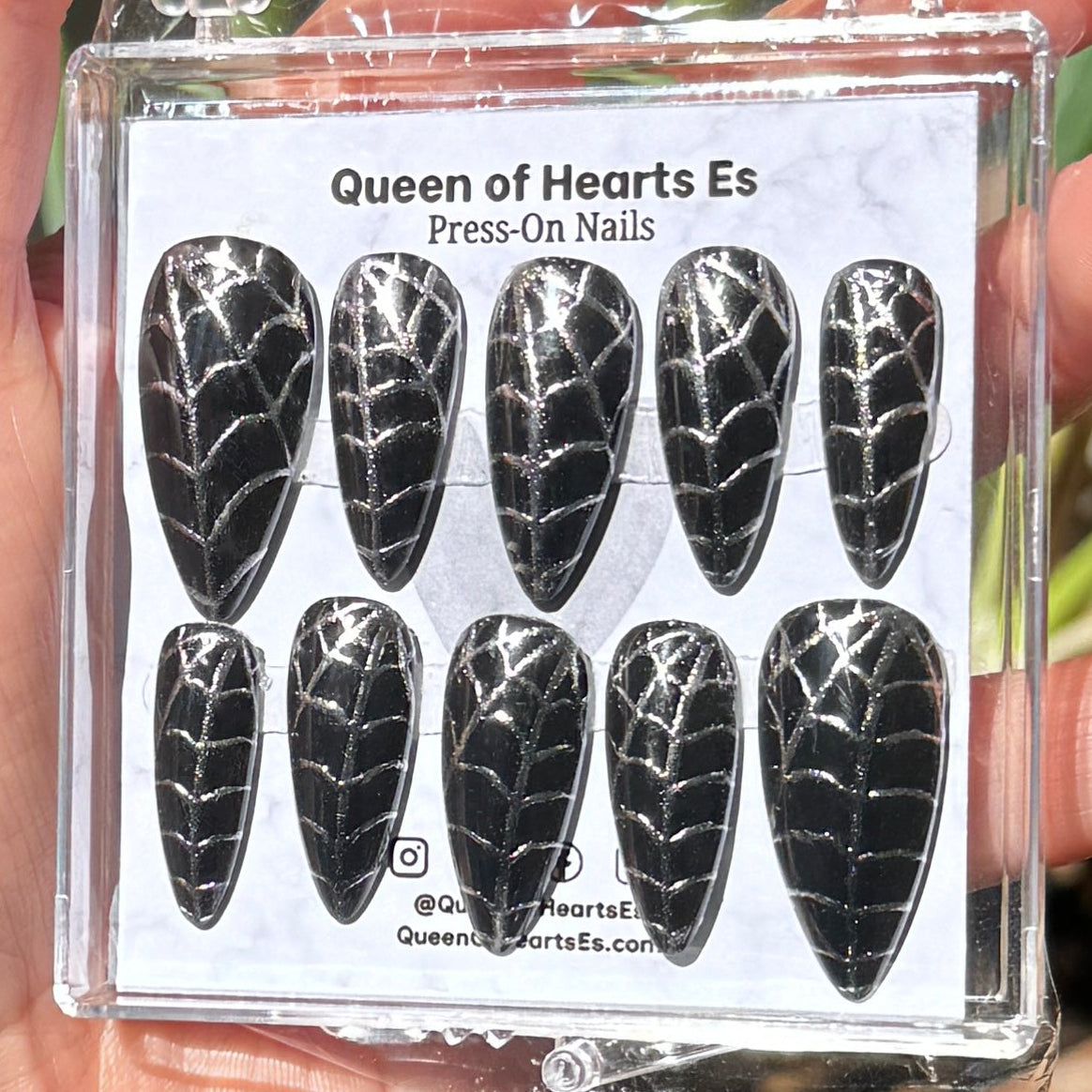 Get ready for "The Silver Weaver" and embrace dark glamour with these stunning handmade press-on nails, featuring a black base and delicate, silver/chrome spiderweb design.&nbsp;