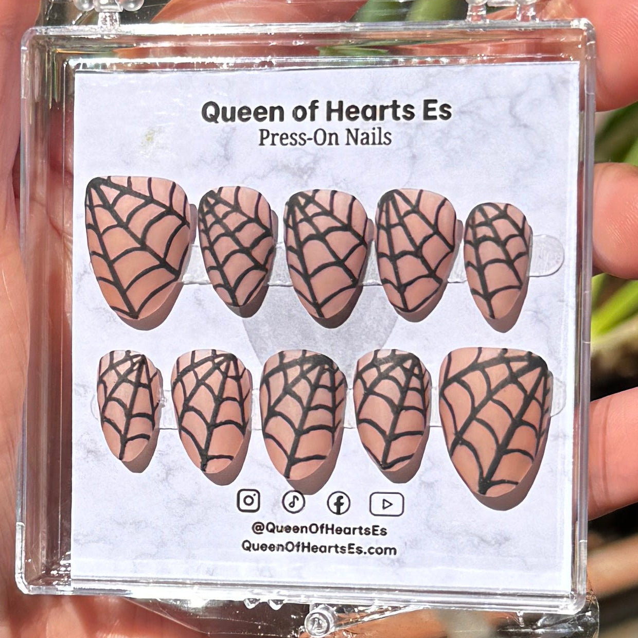 Get ready for "The Nude Weaver" and embrace dark glamour with these stunning handmade press-on nails, featuring a nude base and delicate, black spiderweb design.