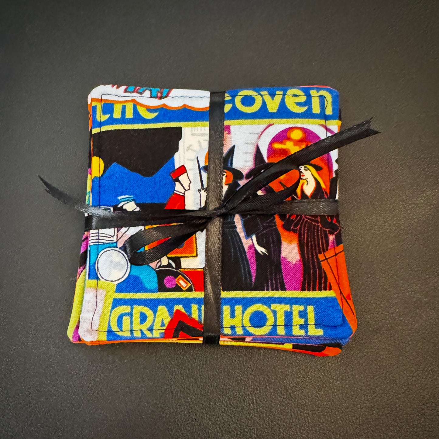 Add a touch of retro macabre and cinematic dark fantasy to your home decor. This set of 4 handmade fabric coasters features vibrant, vintage-inspired pulp horror illustrations, capturing the classic aesthetic of gothic romance, vintage horror novels, and eerie travel advertisements.