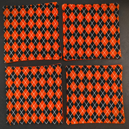 Bring a touch of retro mid-century charm and alternative flair to your tabletop with this set of 4 handmade cotton coasters. Featuring a striking, high-contrast geometric pattern, these coasters perfectly blend vintage pin-up glamour, rockabilly style, and a subtle nod to classic spooky aesthetics.