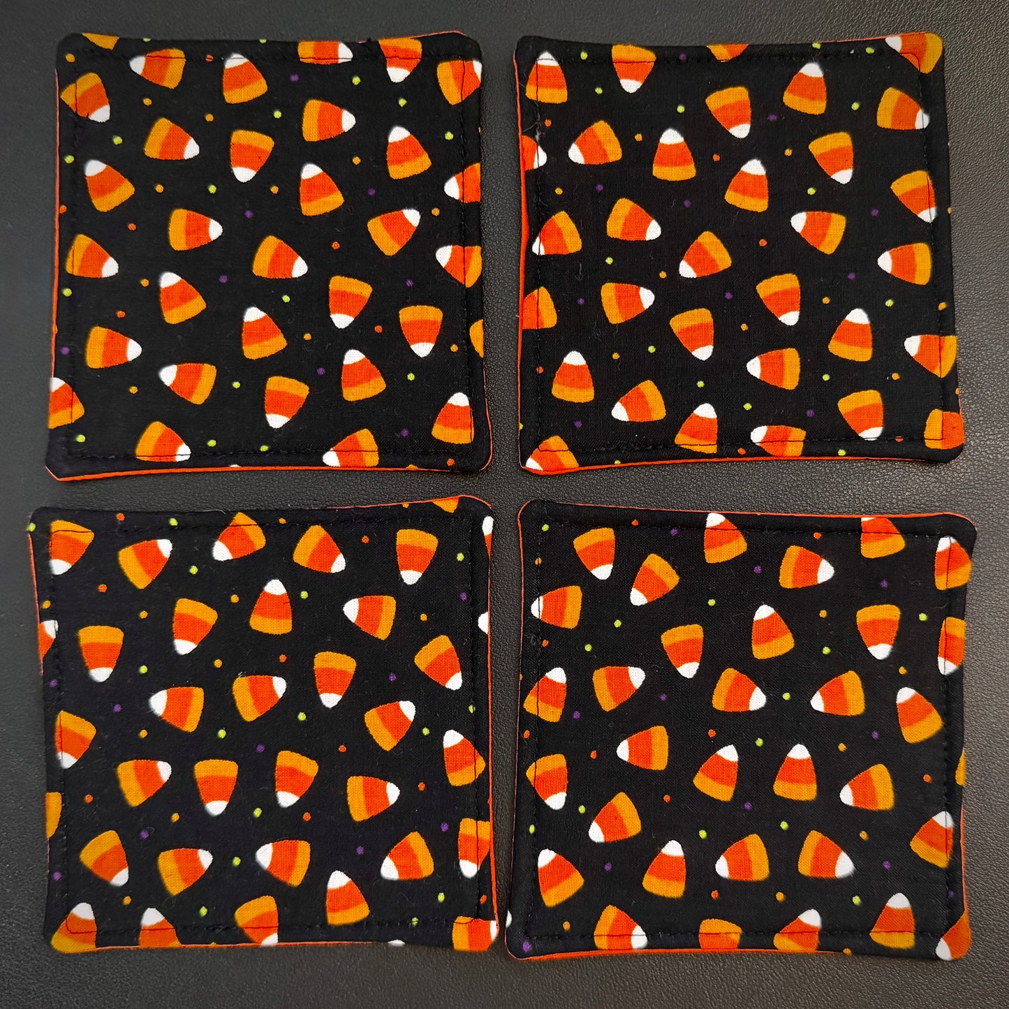 Celebrate the sweeter side of the spooky season all year round with this matching set of 4 handmade cotton coasters. Perfectly capturing a playful, retro autumn kitsch aesthetic, these drink mats bring a vibrant, nostalgic pop of color to any alternative home decor collection.
