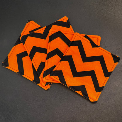Infuse your home with a bold pop of graphic design and alternative flair with this set of 4 handmade cotton coasters. Showcasing a striking, wide zigzag pattern, these drink mats bring together a mid-century retro vibe with an unmistakably edgy, dark aesthetic.