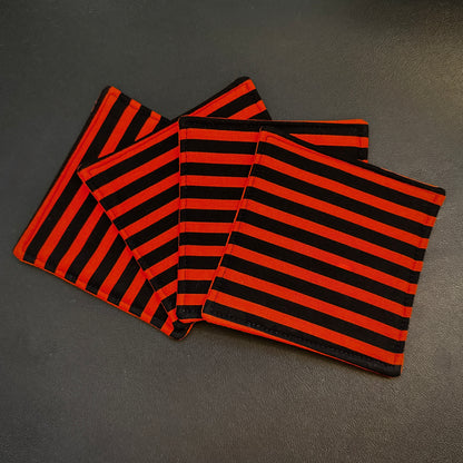 Embrace a classic, timeless pattern with a dark alternative twist with this matching set of 4 handmade cotton coasters. Featuring a striking, high-contrast linear design, these drink mats perfectly channel vintage punk rock, timeless goth culture, and a subtle nod to spooky cinematic aesthetics.