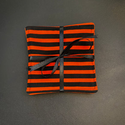 Embrace a classic, timeless pattern with a dark alternative twist with this matching set of 4 handmade cotton coasters. Featuring a striking, high-contrast linear design, these drink mats perfectly channel vintage punk rock, timeless goth culture, and a subtle nod to spooky cinematic aesthetics.