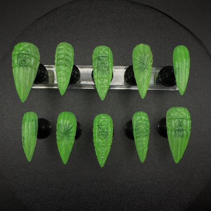 Get ready for "The Uranium Glass" and embrace vintage decor glamour with these stunning handmade press-on nails, featuring a glow-in-the-dark neon green color with a 3D glass effect inspired by vintage uranium glassware.