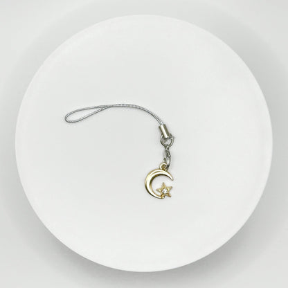 Shine Bright with Our Celestial Moon and Star Charm. This unique, durable, and versatile accessory is perfect for stargazers and dreamers. Attach it to your bag, purse, or backpack for a touch of celestial magic.