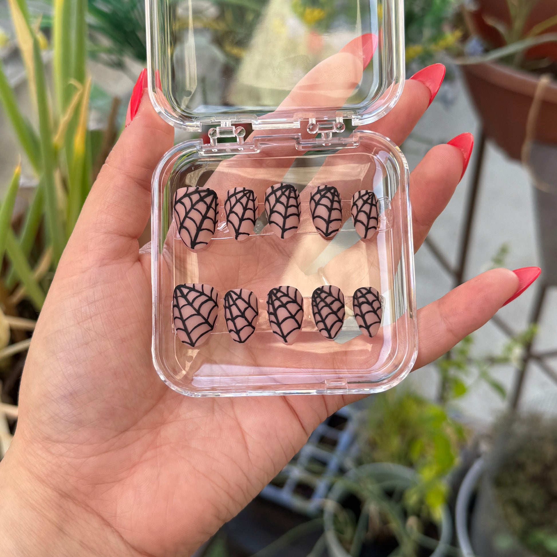 Get ready for "Nude Web" with these stunning, spiderweb design press-on nails. Featuring a nude base and black web with a matte finish. Each set is a miniature work of art, meticulously designed and hand-painted, adding a unique flair to any occasion. No time for salon appointments? Say hello to instant glamour that’s ready whenever you are. Our durable, high-quality press-ons offer a flawless, comfortable fit and are designed to last.