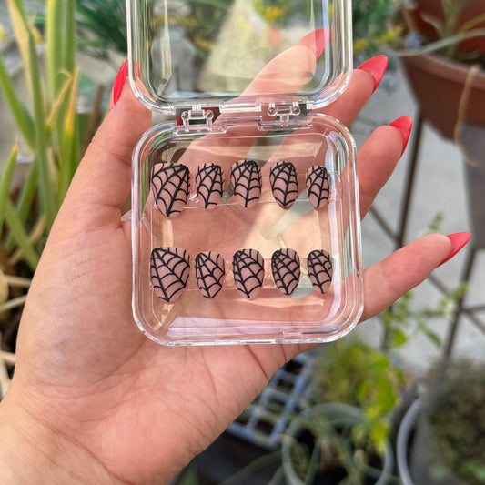 Get ready for "Nude Web" with these stunning, spiderweb design press-on nails. Featuring a nude base and black web with a matte finish. Each set is a miniature work of art, meticulously designed and hand-painted, adding a unique flair to any occasion. No time for salon appointments? Say hello to instant glamour that’s ready whenever you are. Our durable, high-quality press-ons offer a flawless, comfortable fit and are designed to last.