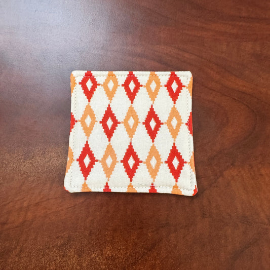 Elevate your space with this playful 100% cotton retro diamond coaster. Featuring a vibrant and stylish retro diamond print, this coaster brings a touch of retro flair and fun to your home. Crafted with an absorbent cotton batting layer inside, it's designed to soak up condensation and protect your furniture from unsightly water rings and spills. Perfect for coffee mugs, glasses, or teacups, this durable and machine-washable coaster is a delightful addition to your kitchen or living room. Elevate your home 