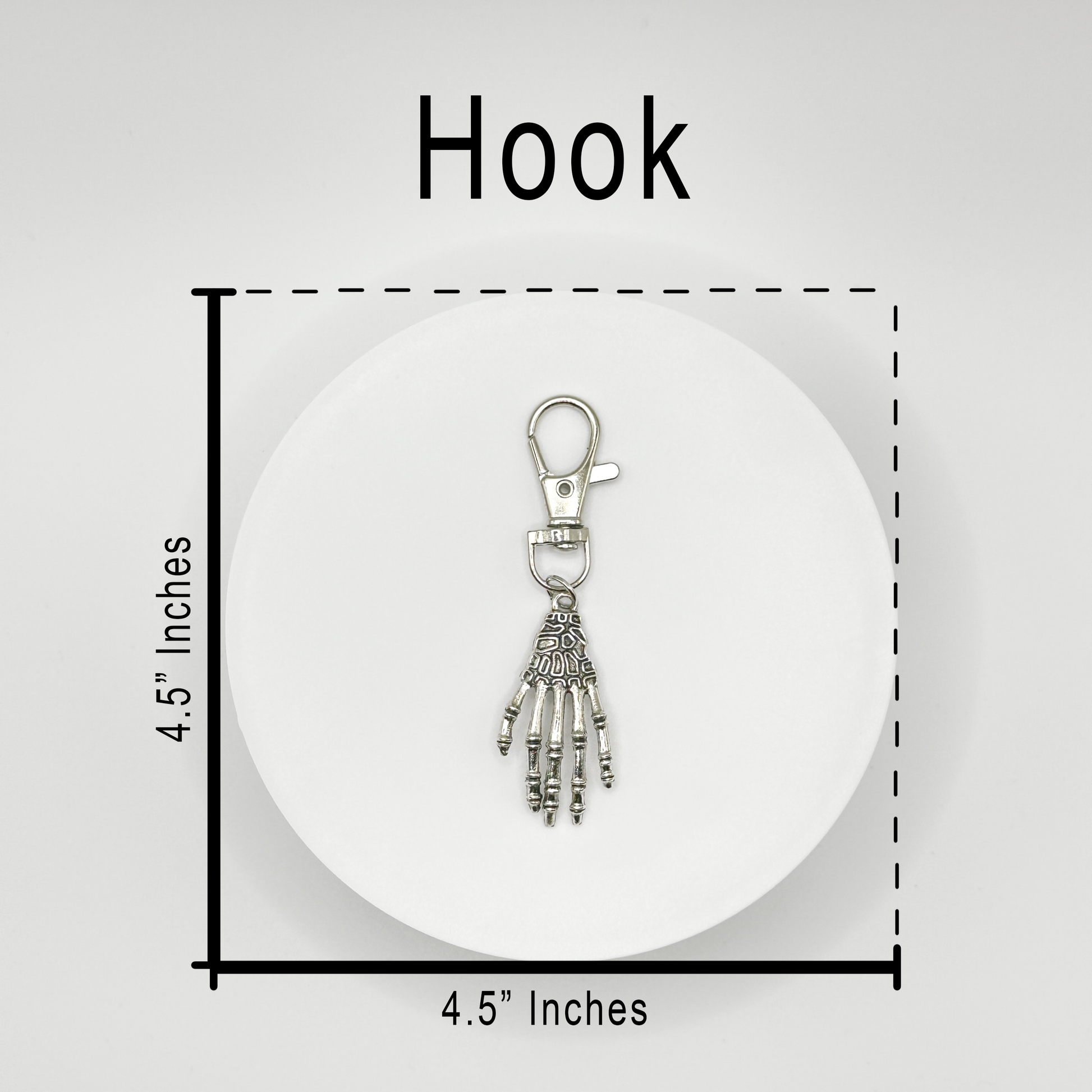 Grasp your style with our spooky skeleton hand charm! This unique, durable, and versatile accessory is perfect for horror fans and dark style lovers. Attach it to your bag, purse, or backpack for a touch of the macabre.