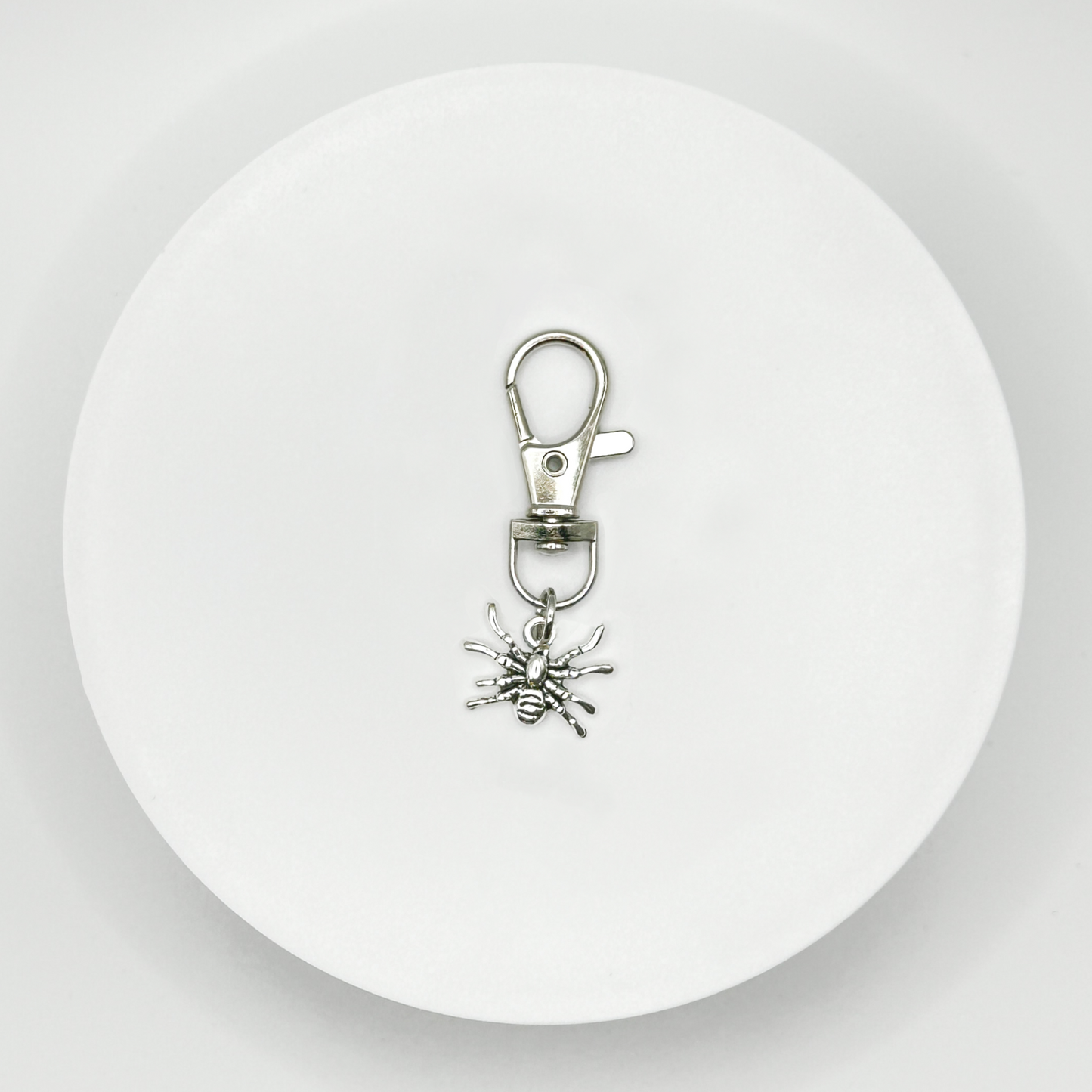 A Spooky-Cute Accessory. This unique, durable, and versatile spider charm is perfect for horror fans and dark style lovers. Attach it to your bag, purse, or backpack for a touch of the macabre.