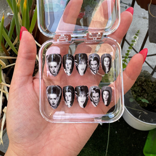Get ready for "The Ghoulies" with these stunning, ghouly icon press-on nails. Featuring 5 of the iconic spooky icons. Each set is a miniature work of art, meticulously designed and hand-painted, adding a unique flair to any occasion. No time for salon appointments? Say hello to instant glamour that’s ready whenever you are. Our durable, high-quality press-ons offer a flawless, comfortable fit and are designed to last.