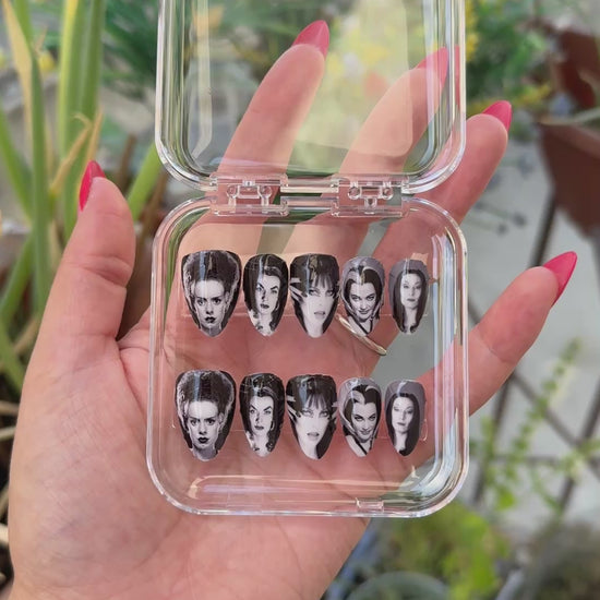 Get ready for "The Ghoulies" with these stunning, ghouly icon press-on nails. Featuring 5 of the iconic spooky icons. Each set is a miniature work of art, meticulously designed and hand-painted, adding a unique flair to any occasion. No time for salon appointments? Say hello to instant glamour that’s ready whenever you are. Our durable, high-quality press-ons offer a flawless, comfortable fit and are designed to last.