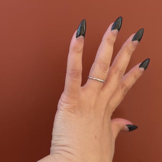 Get ready for "The Black Half Moon" and embrace dark glamour with these stunning handmade press-on nails, featuring a nude base and delicate, black half moon design