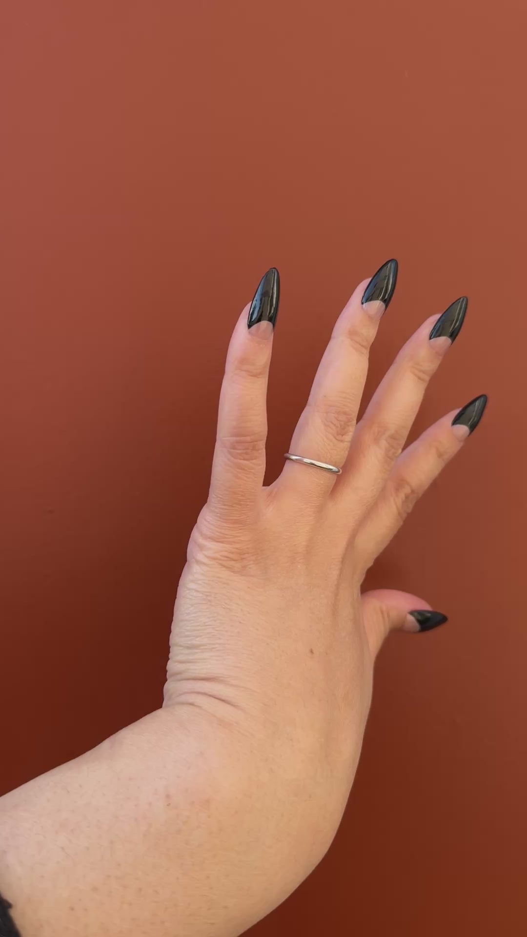Get ready for "The Black Half Moon" and embrace dark glamour with these stunning handmade press-on nails, featuring a nude base and delicate, black half moon design