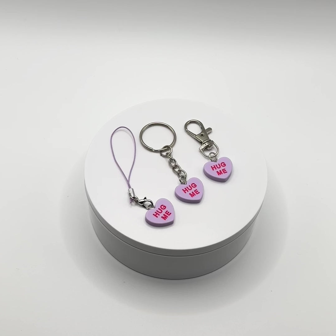 Add a touch of sweetness to your everyday! Our purple candy heart phone charm and keychain is the perfect accessory for Valentine’s Day and beyond. Cute, durable, and versatile, it’s the perfect gift for yourself or a loved one.