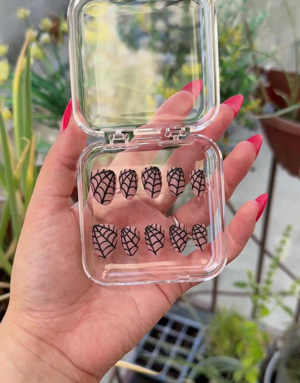 Get ready for "The Nude Weaver" and embrace dark glamour with these stunning handmade press-on nails, featuring a nude base and delicate, black spiderweb design.