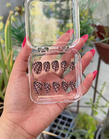 Get ready for "The Nude Weaver" and embrace dark glamour with these stunning handmade press-on nails, featuring a nude base and delicate, black spiderweb design.