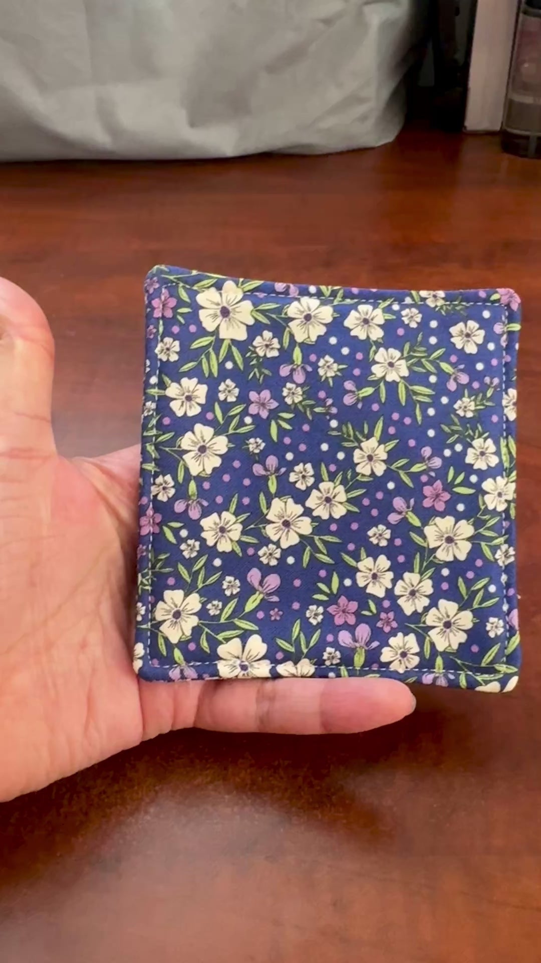 Elevate your space with this playful 100% cotton pink floral coaster. Featuring a vibrant and stylish floral print, this coaster brings a touch of floral and fun to your home. Crafted with an absorbent cotton batting layer inside, it's designed to soak up condensation and protect your furniture from unsightly water rings and spills. Perfect for coffee mugs, glasses, or teacups, this durable and machine-washable coaster is a delightful addition to your kitchen or living room. Elevate your home decor with thi