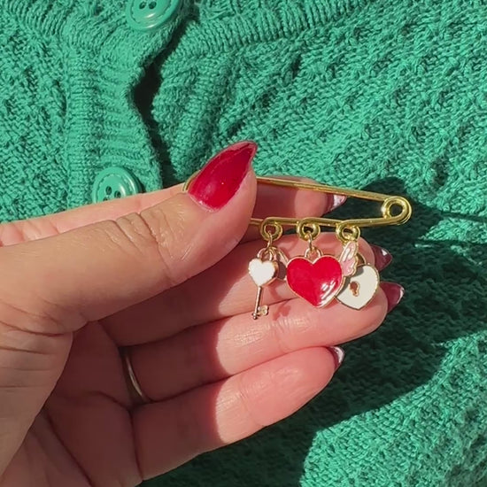 Elevate your Valentines Day or Galentines Day with this adorable gold iron pin brooch featuring a key to a heart enamel charms. Perfect for adding a touch of love to any outfit.