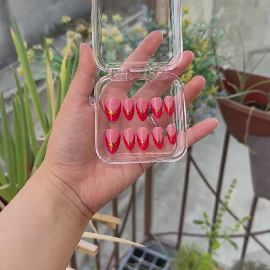 Get ready for "Red Retro Starburst" with these stunning, retro starburst design press-on nails. Featuring a pink base, red french tip design, and gold starbursts with a glossy finish. Each set is a miniature work of art, meticulously designed and hand-painted, adding a unique flair to any occasion. No time for salon appointments? Say hello to instant glamour that’s ready whenever you are. Our durable, high-quality press-ons offer a flawless, comfortable fit and are designed to last.